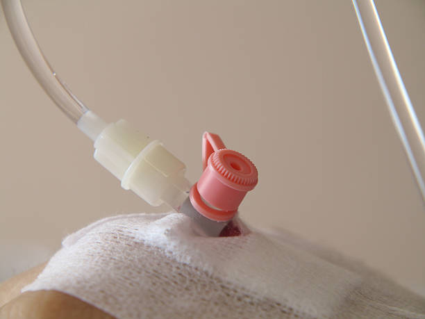 istock Patient's hand in the hospital with an IV 179014237