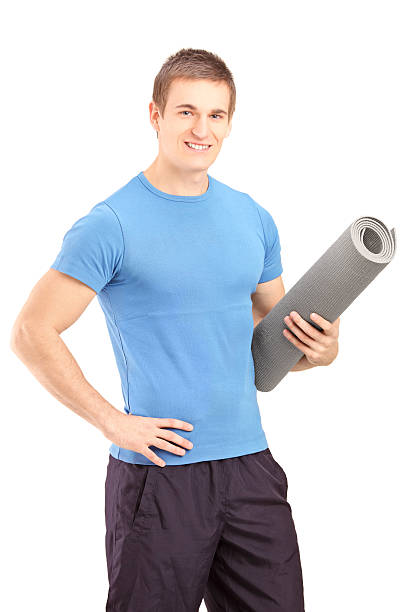 istock Male athlete holding a mat 179016534