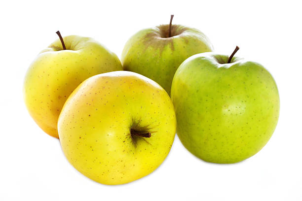 istock four fresh  yellow green apples isolated on a white background 179016707