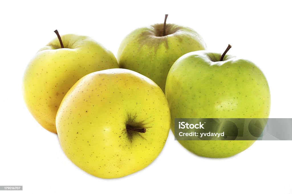 four fresh  yellow green apples isolated on a white background Agriculture Stock Photo