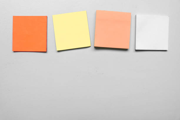 istock Different Blank four colorful sticky notes isolated on gray background with space for text. Place for text. Vertical blank sticky note. Copy space. 1790167187