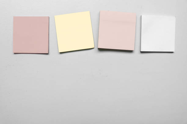 istock Different Blank four colorful sticky notes isolated on gray background with space for text. Place for text. Vertical blank sticky note. Copy space. 1790167188