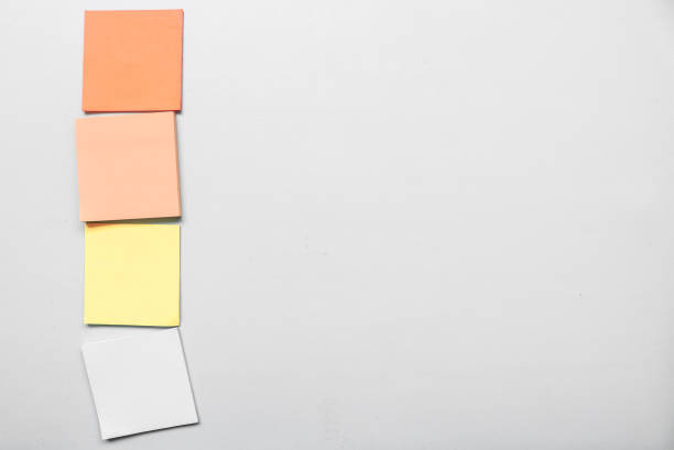 istock Different Blank four colorful sticky notes isolated on gtay background with space for text. Place for text. Vertical blank sticky note. Copy space. 1790170284