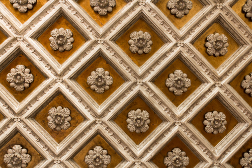In the picture detail of the Basilica of Santa Maria del Fiore in Florence, a patterns of rectangular statues symmetrical.