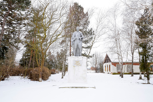 Park in the village Elitnyy, Russia - January 9, 2018: Monument to an unknown soldier in the park of the settlement of Elitnyy Krasnodar Krai, Russia. Monument in memory of the deceased soldiers in the Great Patriotic War. Public monument of an unknown author, built in Soviet times. Author unknown.