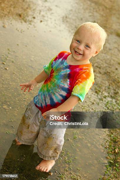 Cute Dirty Baby In Rain Puddle Stock Photo - Download Image Now - Stained, Grass, Child