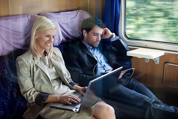 istock business people  on  passenger train using laptop and  digital tablet 179019929