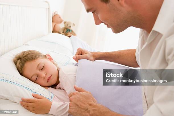 Man Waking Young Girl In Bed Smiling Stock Photo - Download Image Now - 20-29 Years, Adult, Bed - Furniture