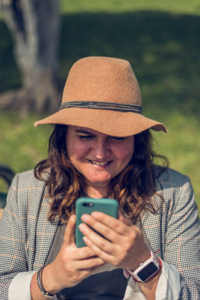 istock Woman communicating on her cell phone. 1790212697