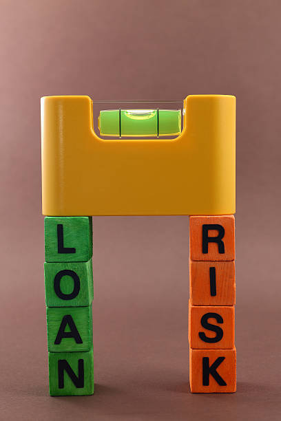 Loan vs. Risk stock photo