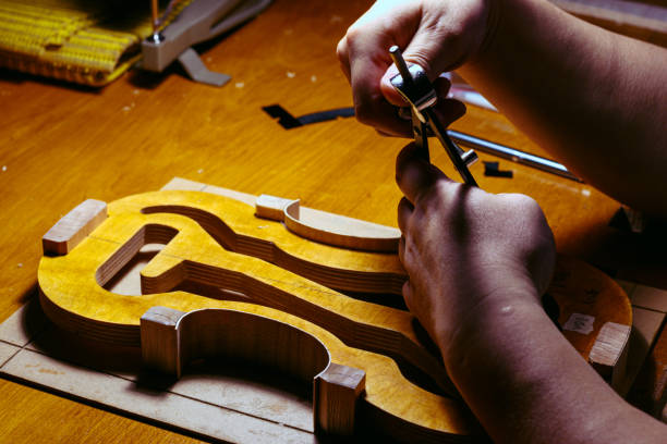 istock artisan violin maker luthier working on violin center bot, corner blocks , bend ribs for a new classic handmade violin 1790216587
