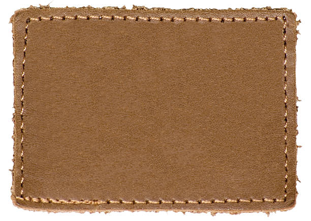istock Natural Blank Beige Brown Leather Label Jeans Tag, Isolated Closeup 179021825