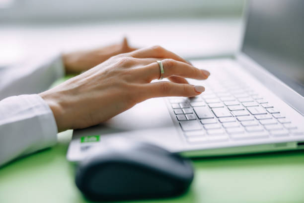 hands of a girl working on a laptop. Remote work, freelancer, or training.