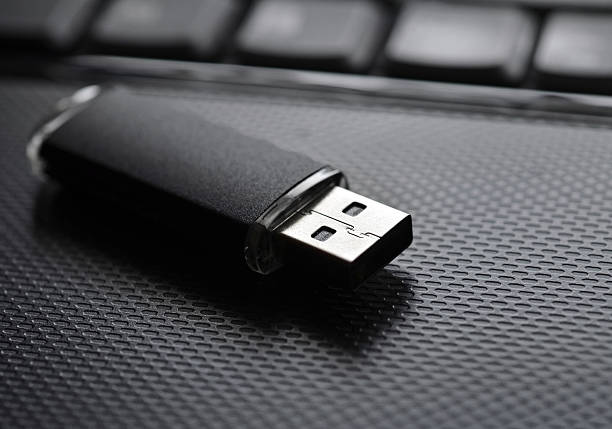 Black and steel colored USB memory stick / flash drive USB flash drive usb stick photos stock pictures, royalty-free photos & images