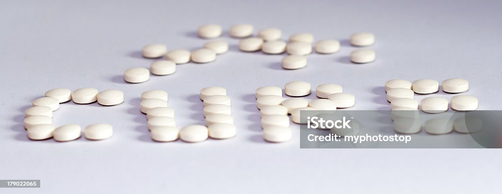 Cura de los comprimidos - Foto de stock de Alivio libre de derechos