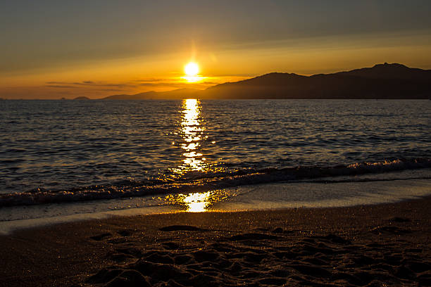 Beach sunset, Corsica stock photo