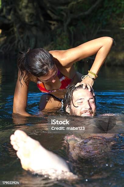 Foto de Jovem Casal Na Água e mais fotos de stock de Aventura - Aventura, Biquíni, Calor