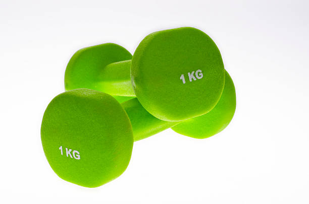 Pair of green dumbbells stock photo