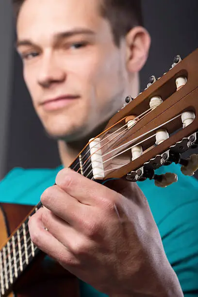 Photo of Young Man With Guitar