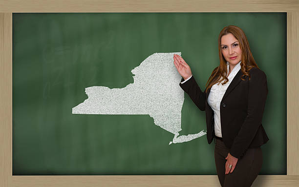 istock Teacher showing map of new york on blackboard 179023932