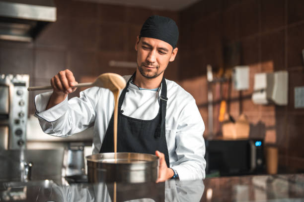 Closeup image of cook making delicious pasta sauce selective focus