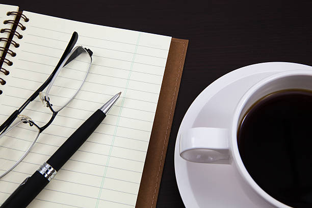 istock Cup of coffee and book 179024460