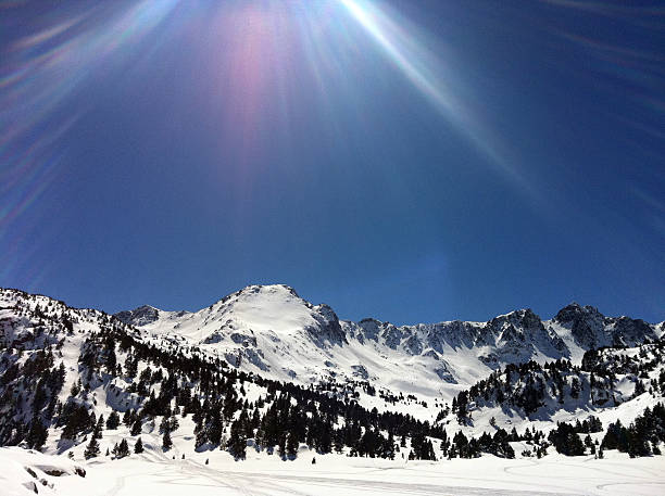 istock Sun beam over snow capped mountains 179025198