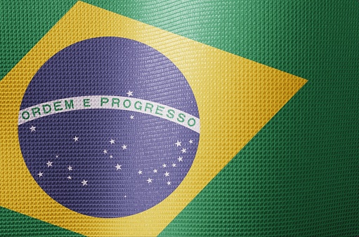 Brazil flag in green yellow and blue close-up, highlighting the pride of Brazilians in vivid fabric
