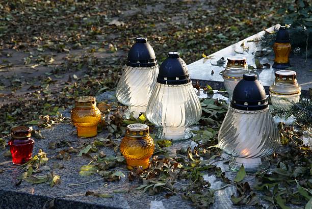 istock tomb with candles in cemetery at autumn 179025739