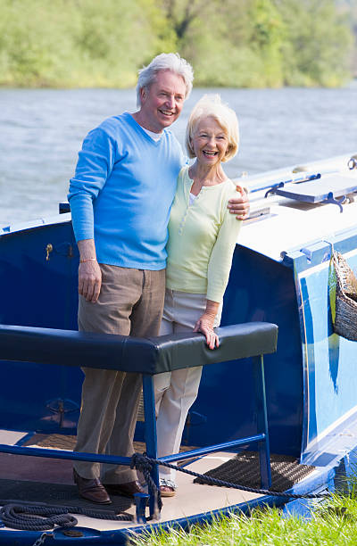 istock Couple outdoors on a boat smiling 179025886