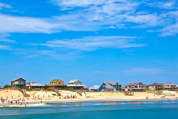 beach with cottages at Nags Head in the outer banks beach with cottages at Nags Head in the outer banks outer banks north carolina stock pictures, royalty-free photos & images
