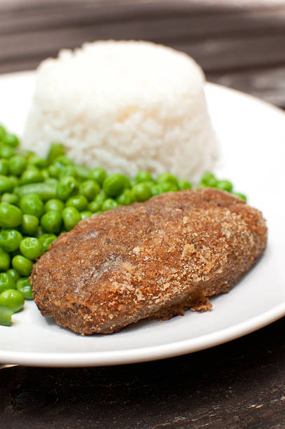 istock Breaded cutlet with rice and green salad 179026449