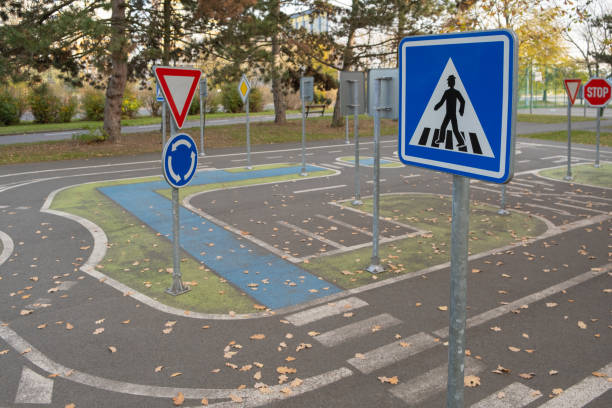 istock A children's playground designed as a mini road with road signs, providing an engaging environment for learning traffic rules and road safety skills through play. Prague, Europe 1790266479