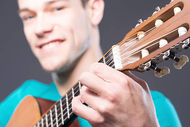 Happy Young Man With Guitar stock photo
