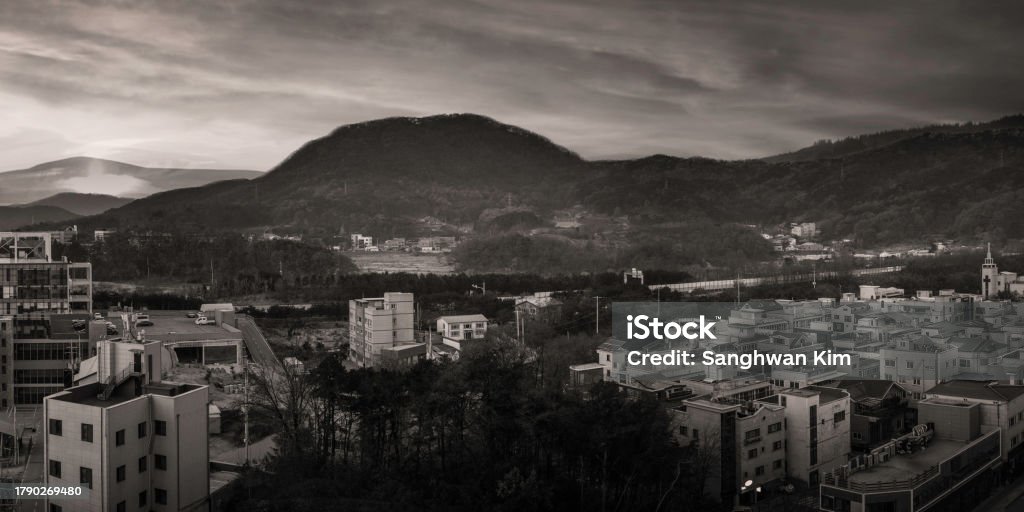 Retro-style mountain town cityscape in black and white colors, an aerial landscape at foggy winter morning in Wonju-si, Gangwon-do, South Korea Architecture Stock Photo
