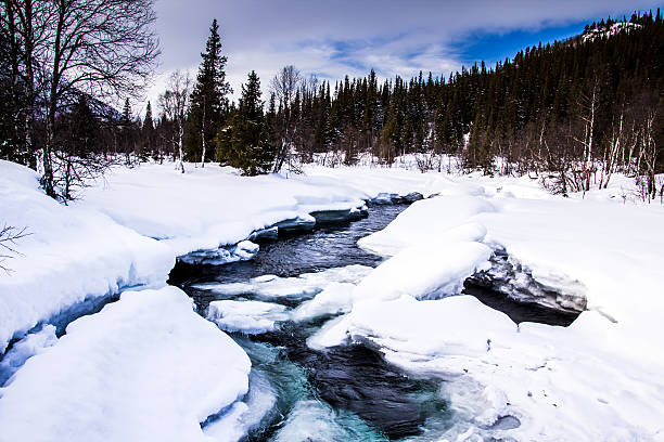 Snowy mountain river, Norway stock photo