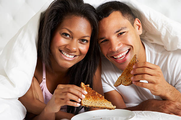 istock Couple Enjoying Breakfast In Bed 179028140