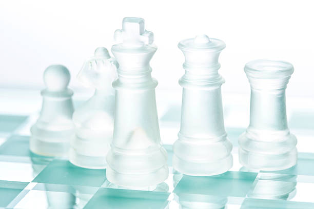 xadrez de vidro transparente isolado no branco - board game piece leisure games blue isolated imagens e fotografias de stock