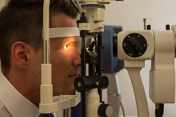 istock Patient at slit lamp of optician or optometrist 179029032
