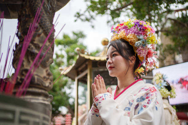 istock A woman praying in a temple 1790294947
