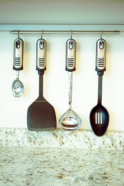 istock set of kitchen utensils hanging on the wall 179029759