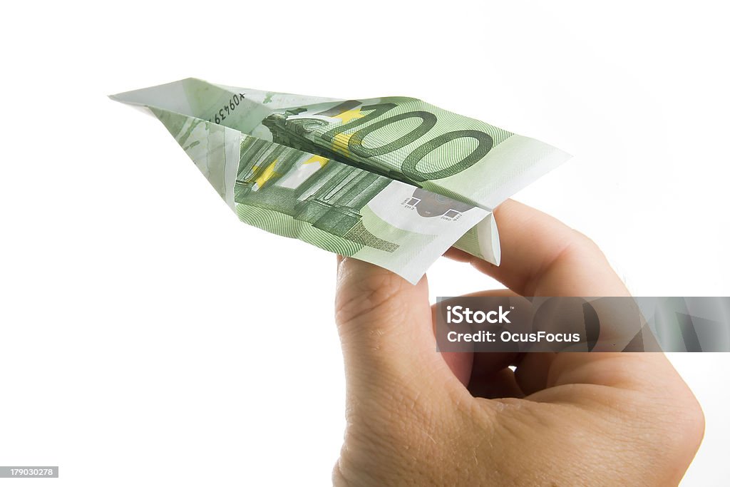 Hand Holding Banknote Paper Plane Man Hand Holding Banknote Paper Plane isolated on White Background European Union Currency Stock Photo