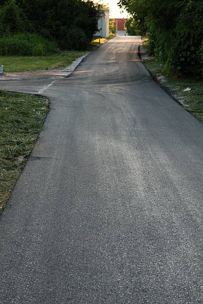 Asphalt road Hot asphalt road at settlement. hard bituminous coal stock pictures, royalty-free photos & images