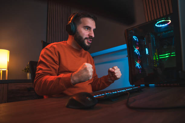 istock Triumphant Victory, Man Reacting to Game Success 1790307501