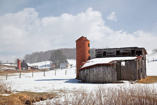 istock Barns in the Winter Snow 179032282