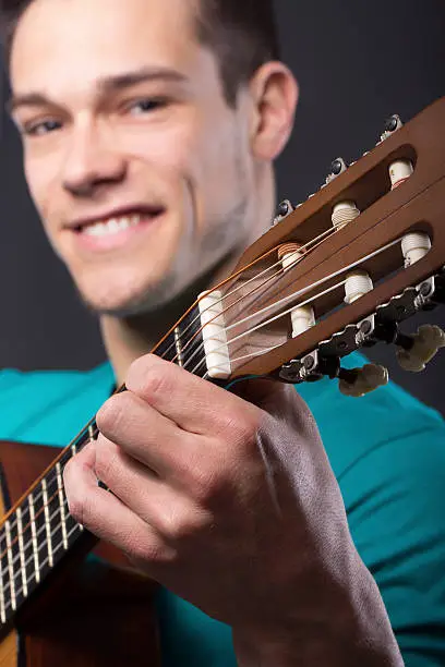 Photo of Happy Young Man With Guitar