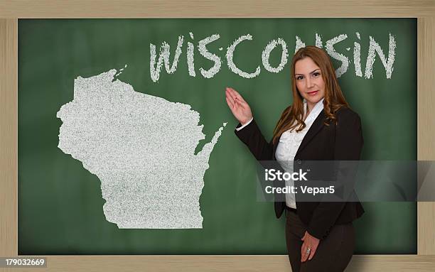 Teacher Showing Map Of Wisconsin On Blackboard Stock Photo - Download Image Now - Adult, Beauty, Business