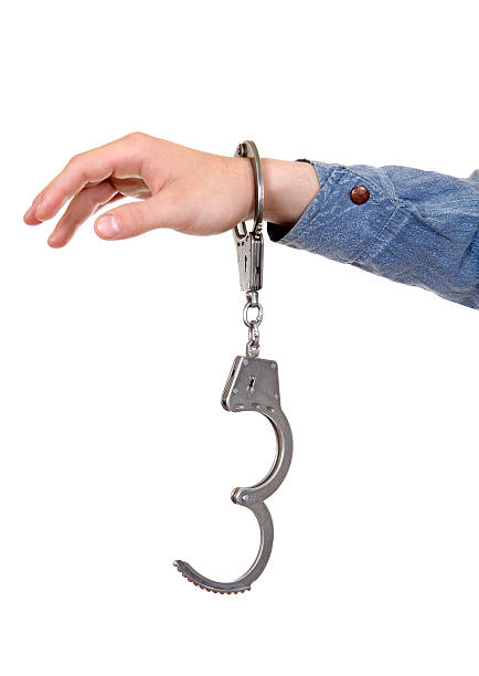 istock Unlocked Handcuffs on a Hand 179032711