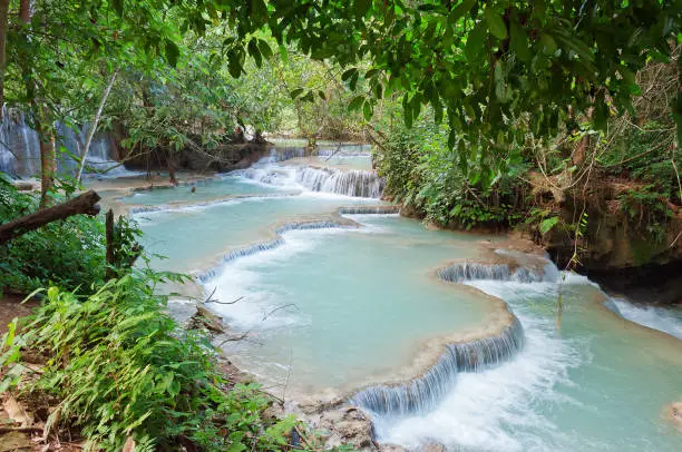 The Kuang Si Falls, sometimes spelled Kuang Xi, is a three tier waterfall about 29 kilometres (18 mi) south of Luang Prabang in Laos.