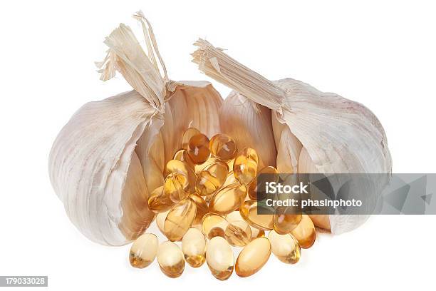 Garlic With Oil Soft Capsule Isolated On White Background Stock Photo - Download Image Now